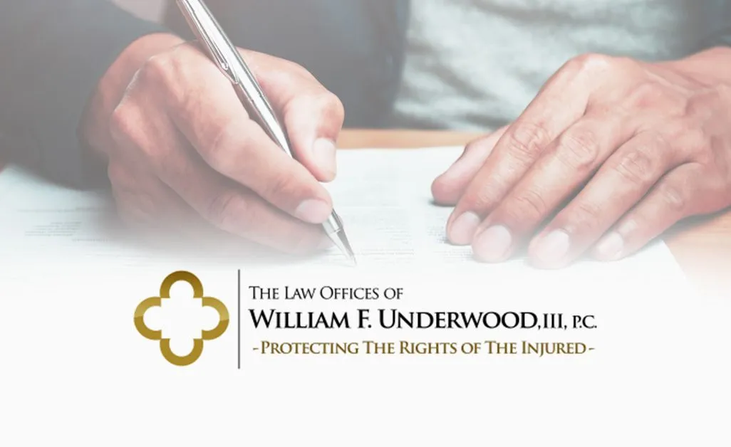 Close-up of hands writing on a document above text for The Law Offices of William F. Underwood, III, P.C. logo and slogan.