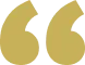 A pair of large, stylized golden quotation marks on a transparent background.